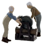O-SCALE GRINDER WORKING ON LUMBERJACK'S AXES